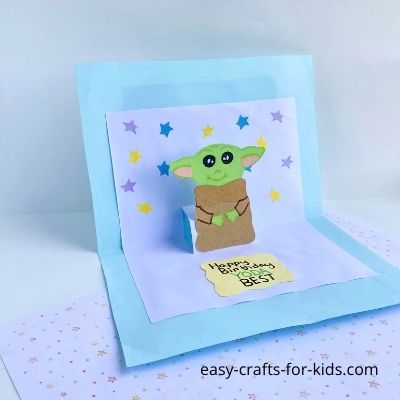 https://www.easy-crafts-for-kids.com/how-to-make-yoda-pop-up-birthday-card.html/yoda-pop-up-card-diy